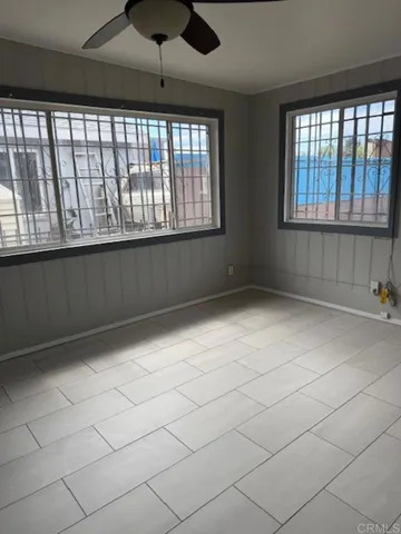 a view of an empty room with a window