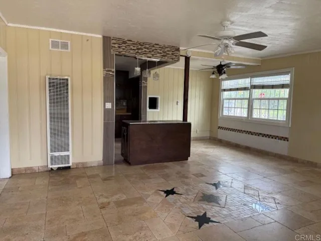 a living room with a couch and a window