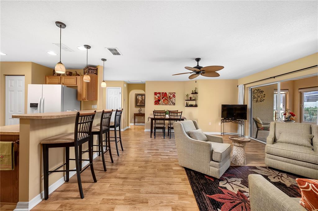 8180 Southwest 80th Terrace Ocala, FL 34476 - Photo 11 of 34 a living room with lots of furniture and a chandelier