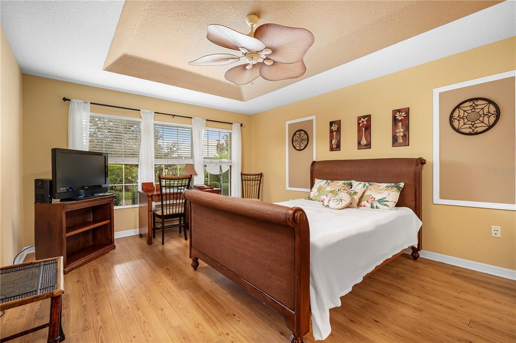 8180 Southwest 80th Terrace Ocala, FL 34476 - Photo 18 of 34 a bedroom with a bed and a flat screen tv