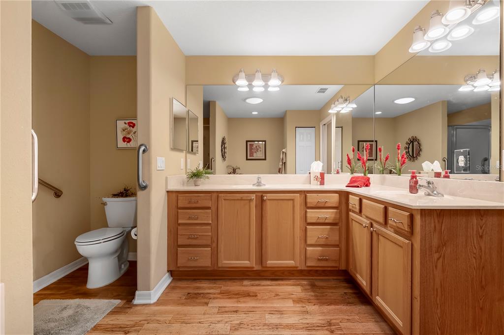 8180 Southwest 80th Terrace Ocala, FL 34476 - Photo 22 of 34 a spacious bathroom with a double vanity sink mirror and toilet