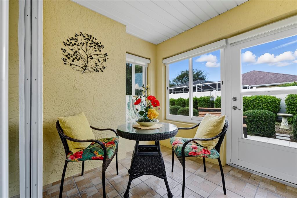 8180 Southwest 80th Terrace Ocala, FL 34476 - Photo 4 of 34 a view of a dining room with furniture wooden floor and a potted plant
