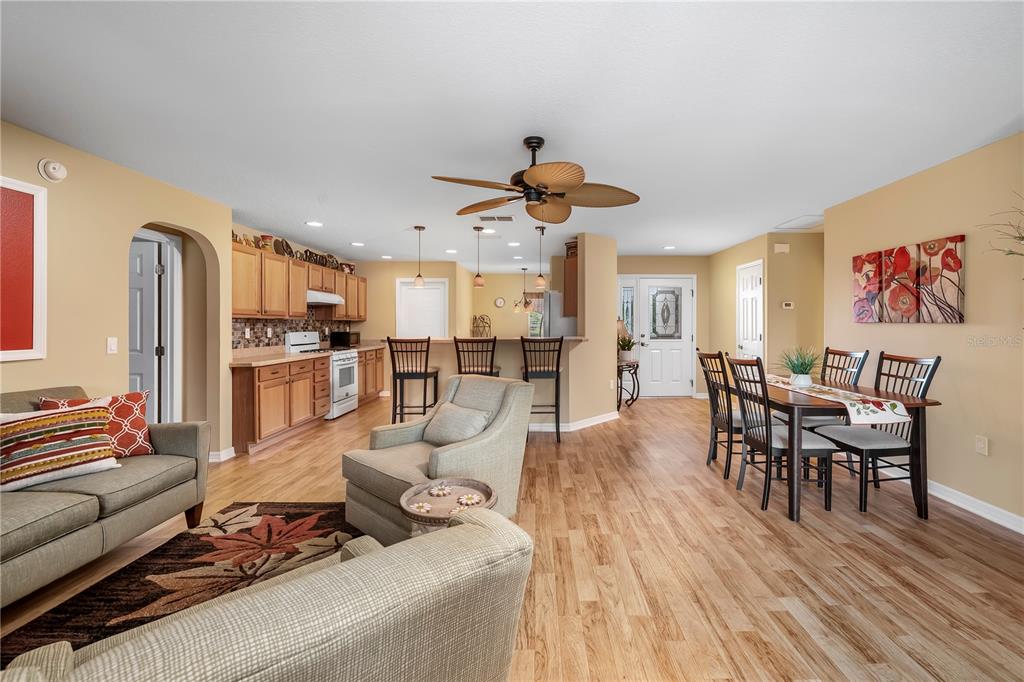 8180 Southwest 80th Terrace Ocala, FL 34476 - Photo 8 of 34 a living room with furniture kitchen view and a refrigerator