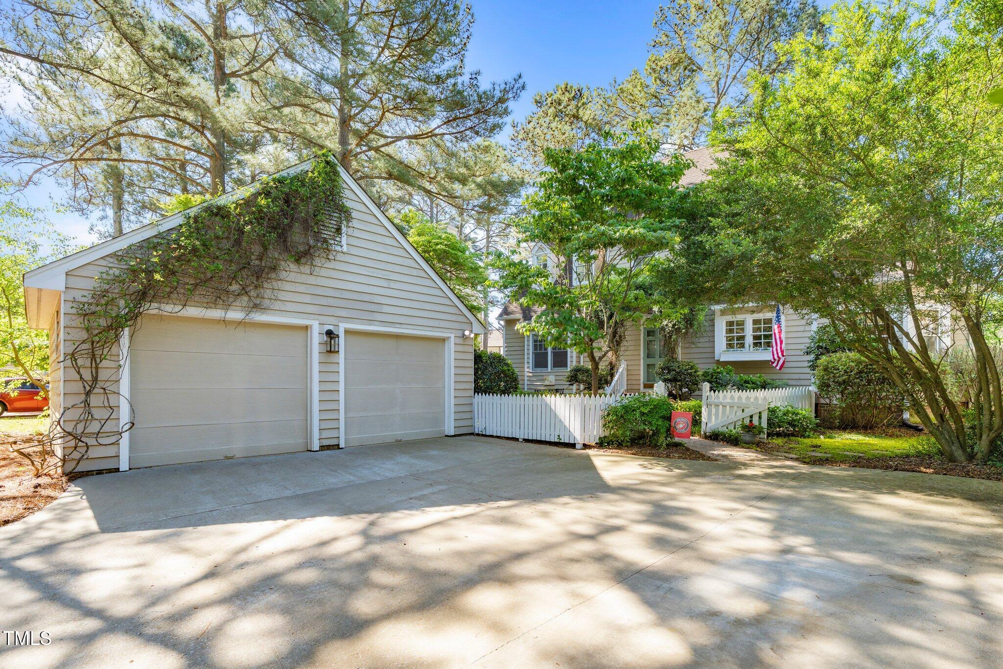 1712 Briarforest Place Raleigh, NC 27615 - Photo 44 of 55 Your parking options include a two car garage and a driveway that can easily hold at least four vehicles.