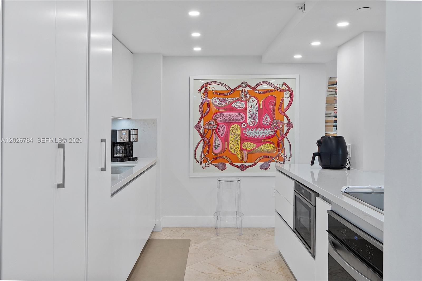 151 Southeast 15th Road, Unit 601 Miami, FL 33129 - Photo 16 of 36 a kitchen with stainless steel appliances a refrigerator and a microwave