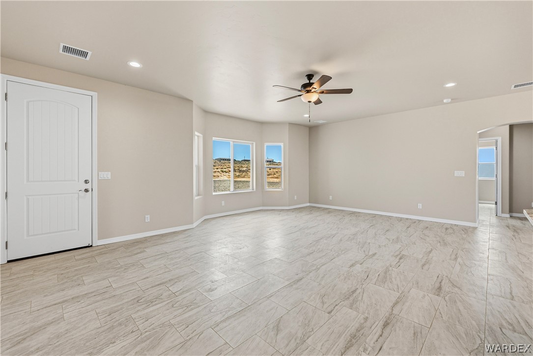 9818 North Cyrus Road Kingman, AZ 86401 - Photo 9 of 42 a view of an empty room with a window
