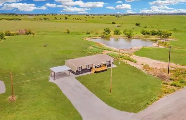 a view of a lake with a big yard