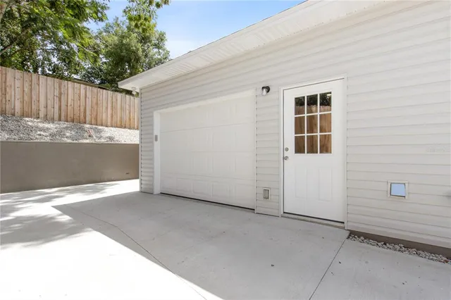 a view of a house with a backyard