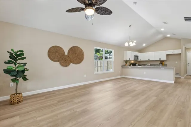 a view of a kitchen with a microwave and a potted plant