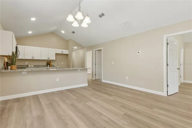 a view of kitchen with wooden floor and window