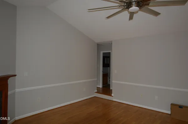 an empty room with a empty space and a ceiling fan