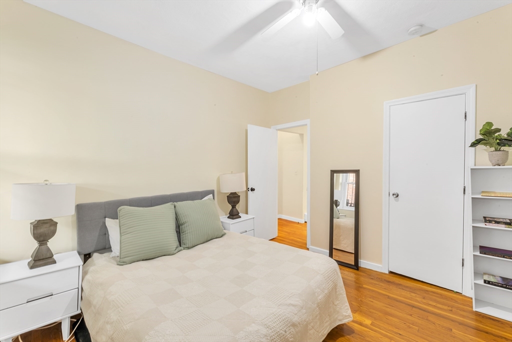 122 Day Street, Unit 3 Boston, MA 02130 - Photo 11 of 14 a bedroom with a bed and wooden floor