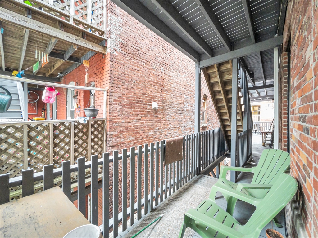 122 Day Street, Unit 3 Boston, MA 02130 - Photo 14 of 14 a view of front door of house with outdoor seating