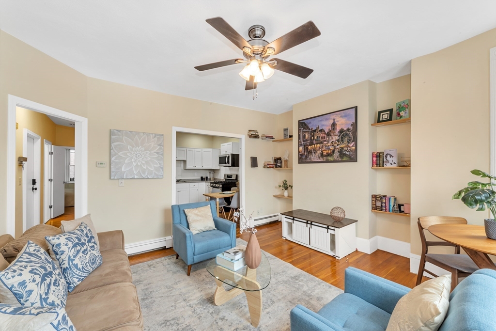 122 Day Street, Unit 3 Boston, MA 02130 - Photo 4 of 14 a living room with furniture kitchen view and a window