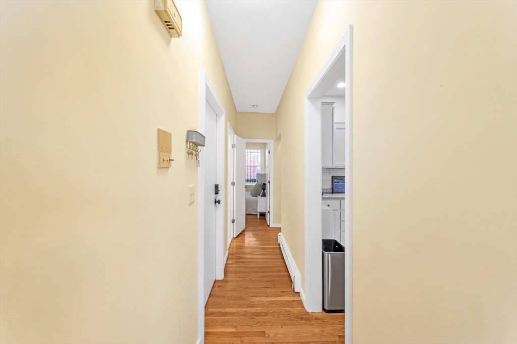 122 Day Street, Unit 3 Boston, MA 02130 - Photo 8 of 14 a view of a hallway with wooden floor