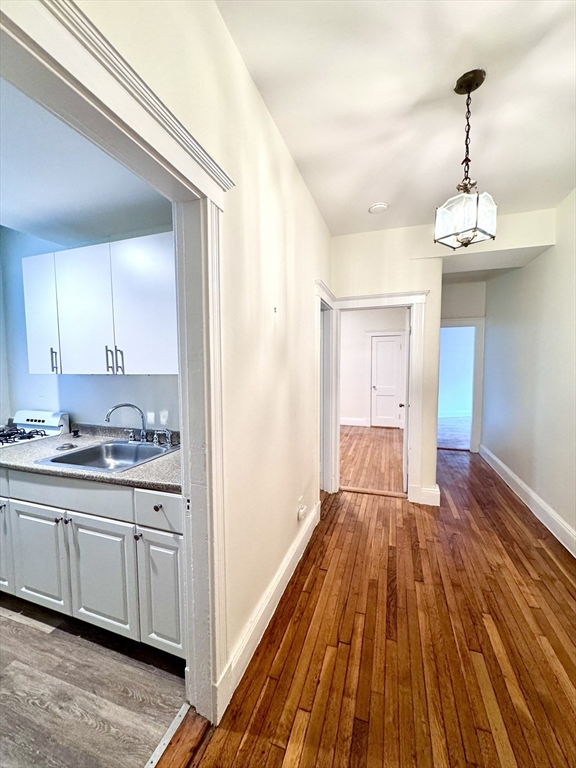 28 Sidlaw Road, Unit 2 Boston, MA 02135 - Photo 5 of 8 a spacious bathroom with a sink and a mirror