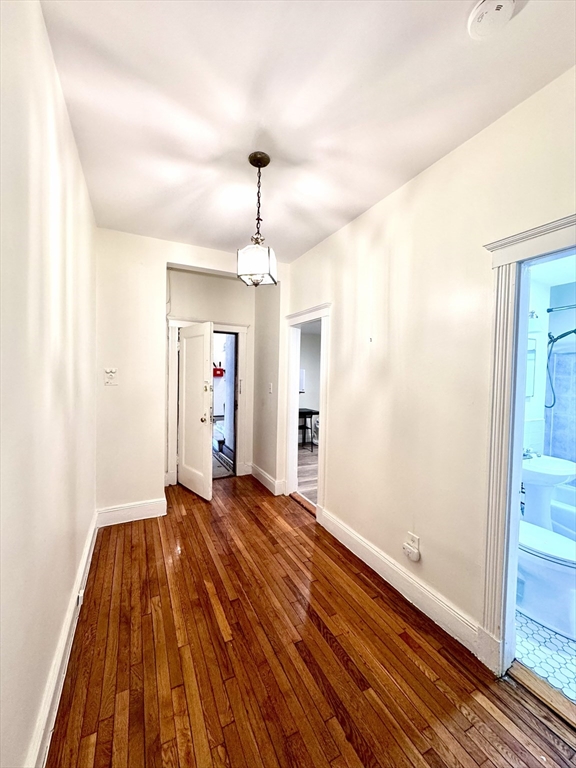 28 Sidlaw Road, Unit 2 Boston, MA 02135 - Photo 6 of 8 a view of empty room with wooden floor