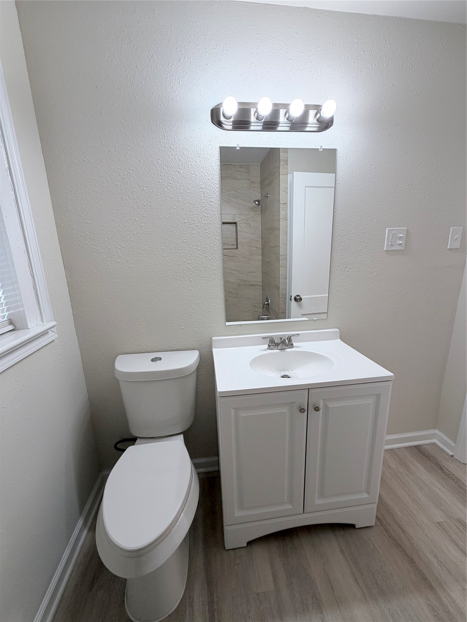 1003 Linden Street La Marque, TX 77568 - Photo 13 of 19 a bathroom with a sink and mirror