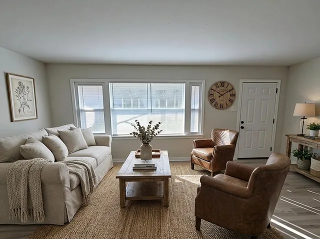 a living room with furniture and a window