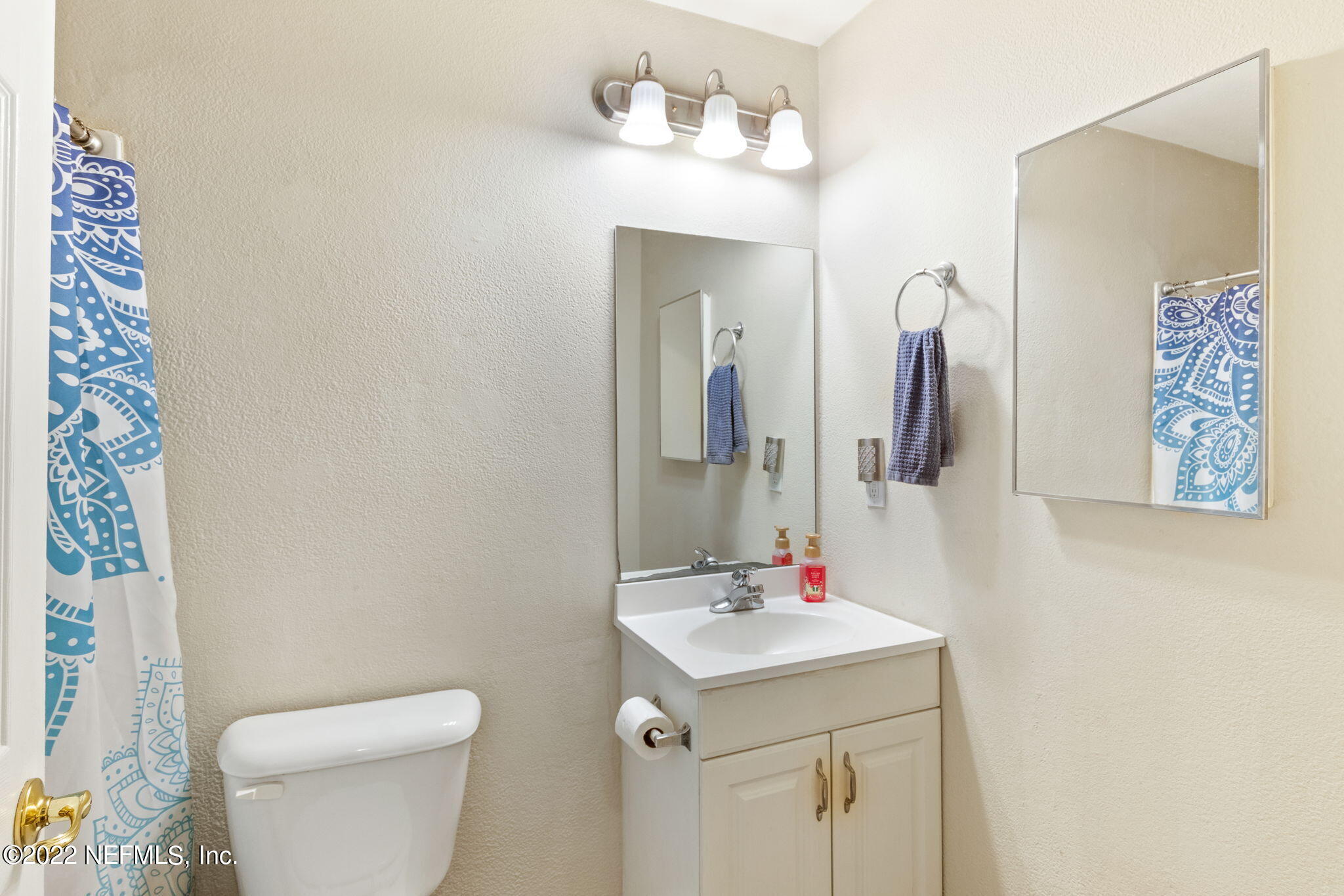 4420 Carter Road, Unit 5 St. Augustine, FL 32086 - Photo 11 of 29 a bathroom with a sink and a mirror