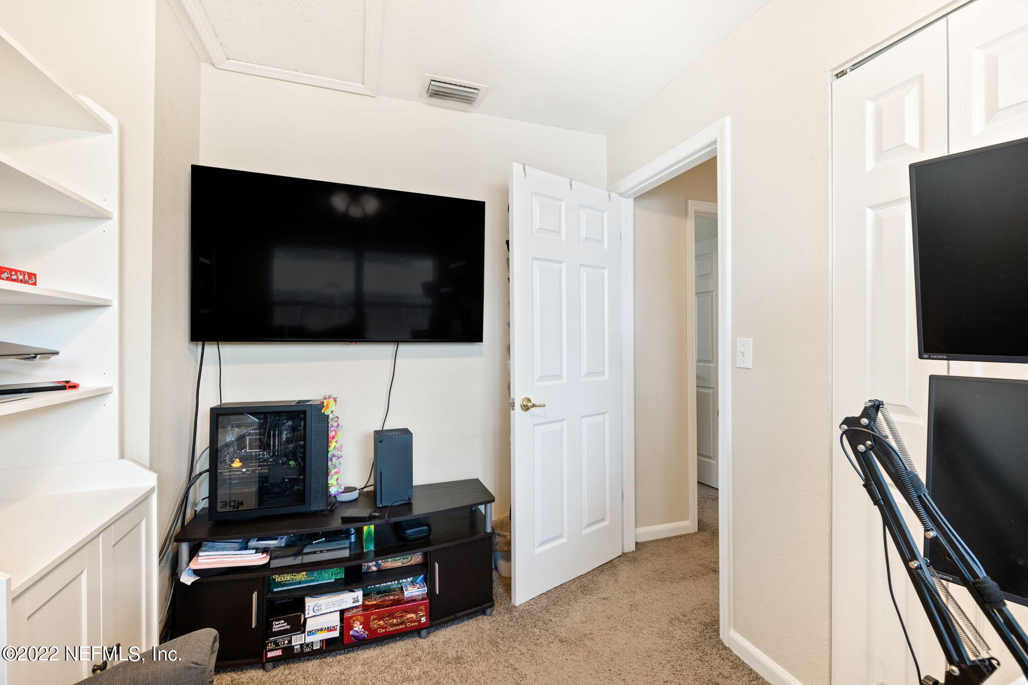 4420 Carter Road, Unit 5 St. Augustine, FL 32086 - Photo 13 of 29 a view of a livingroom with furniture and a flat screen tv