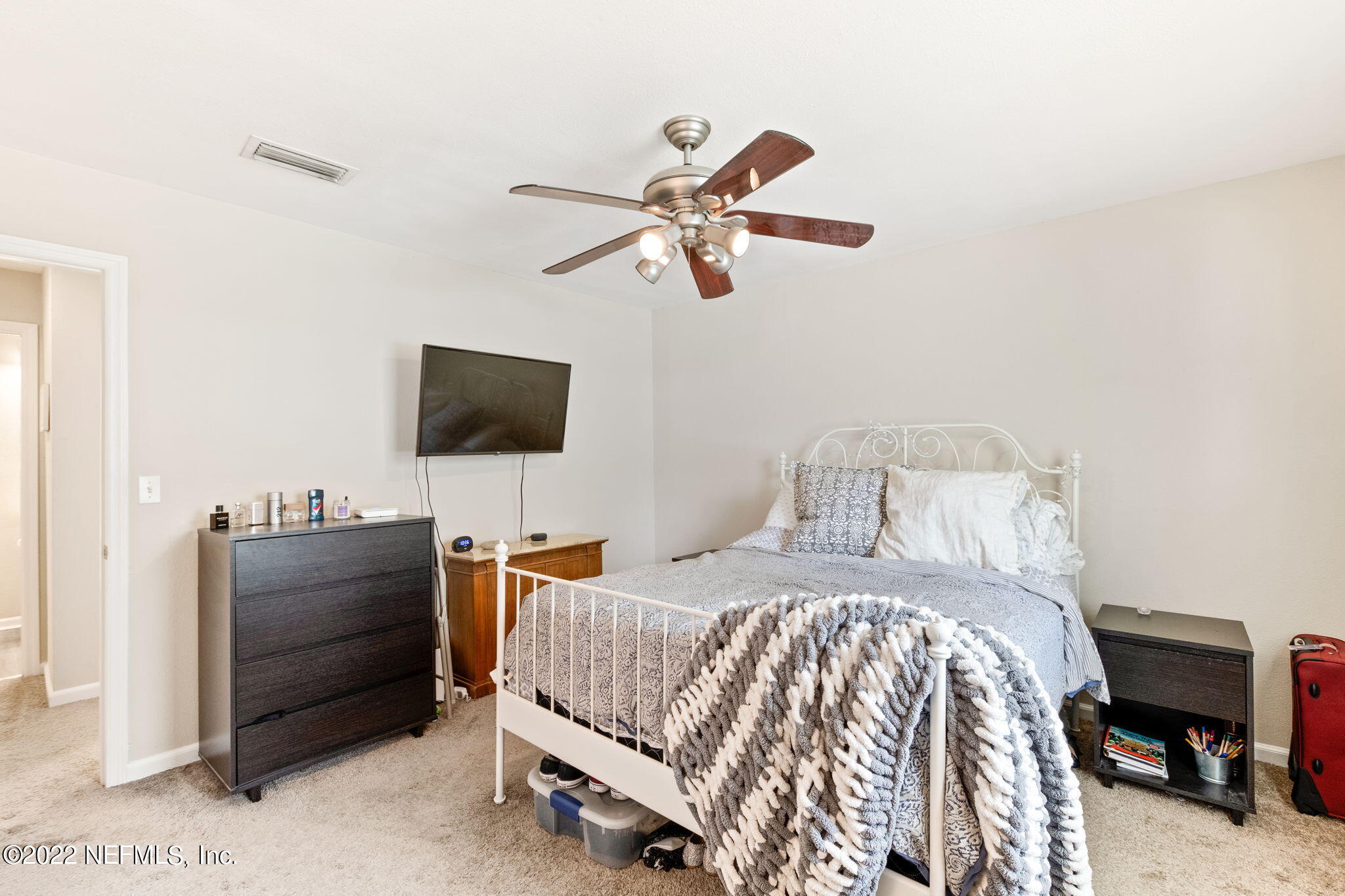 4420 Carter Road, Unit 5 St. Augustine, FL 32086 - Photo 15 of 29 a bedroom with a bed and a flat screen tv