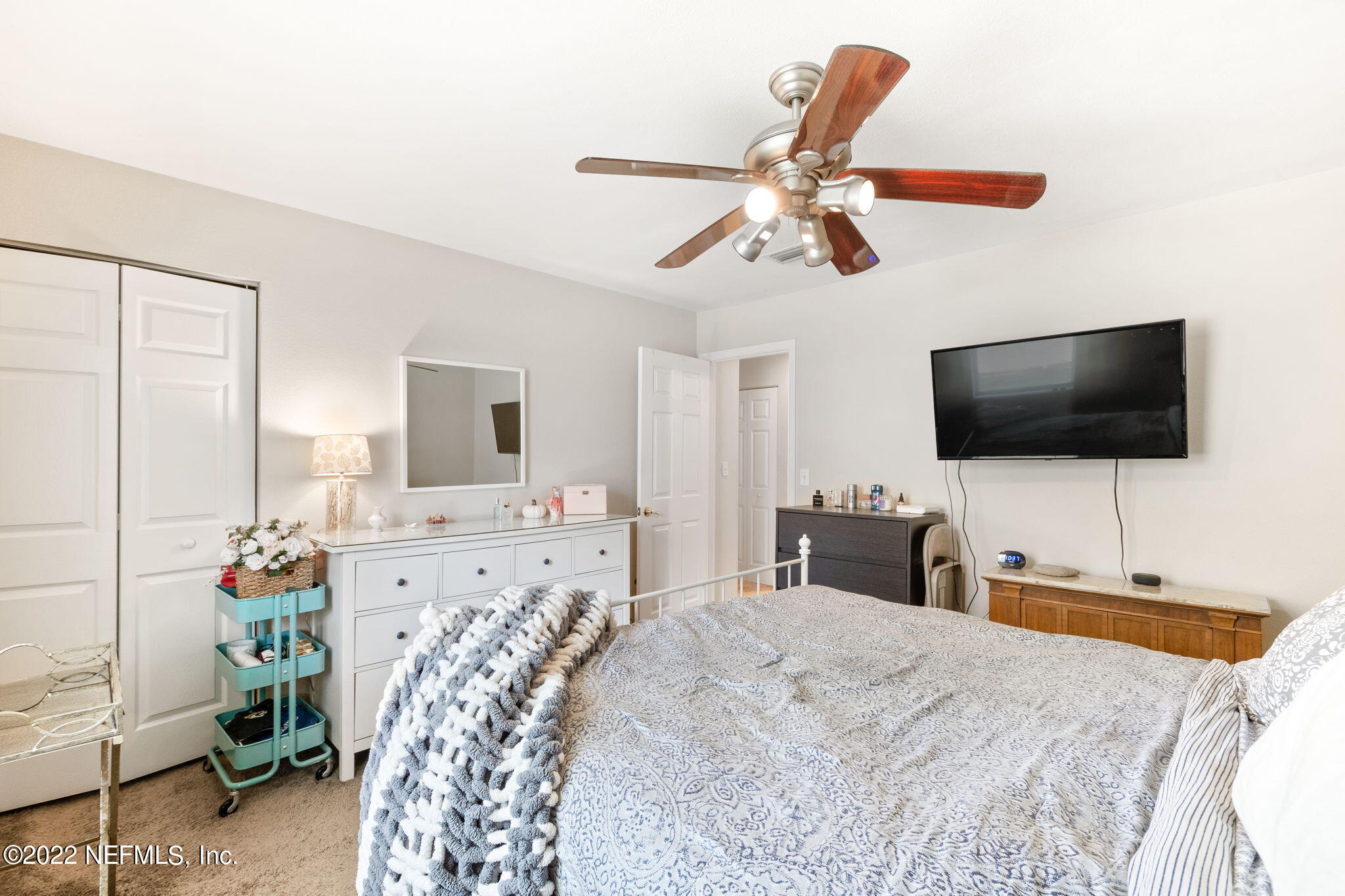 4420 Carter Road, Unit 5 St. Augustine, FL 32086 - Photo 16 of 29 a bedroom with a bed and a flat screen tv