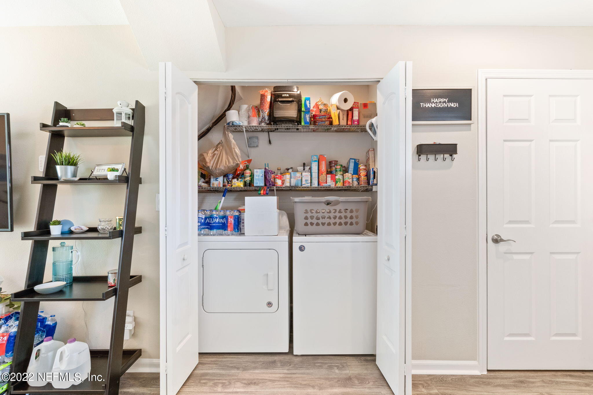 4420 Carter Road, Unit 5 St. Augustine, FL 32086 - Photo 20 of 29 a view of kitchen and utility room with empty racks