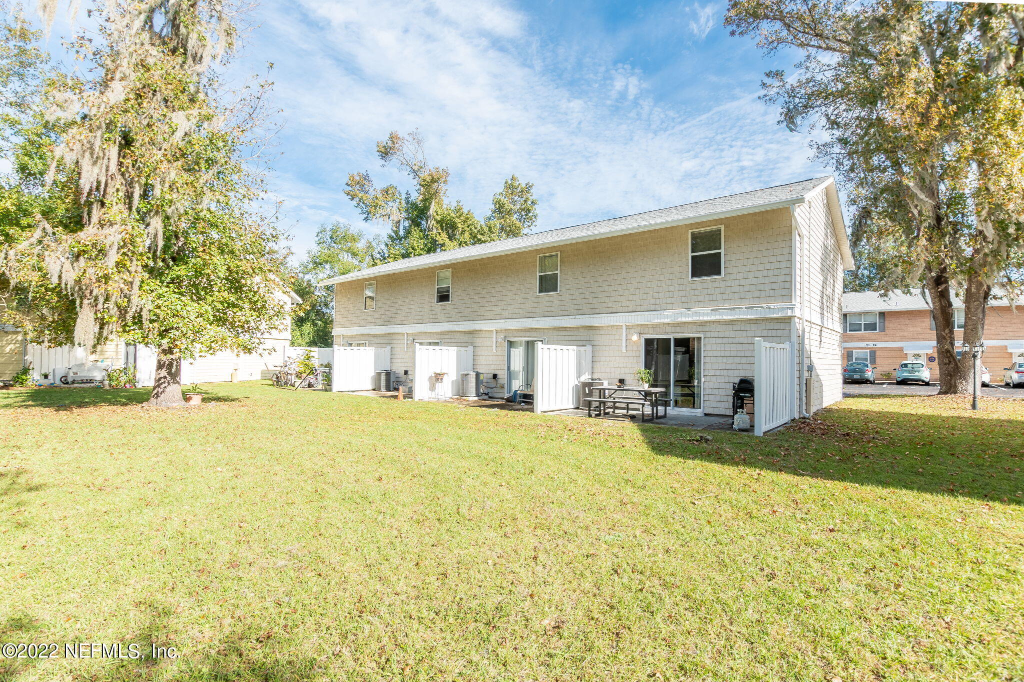 4420 Carter Road, Unit 5 St. Augustine, FL 32086 - Photo 24 of 29 a view of a house with a yard and sitting area