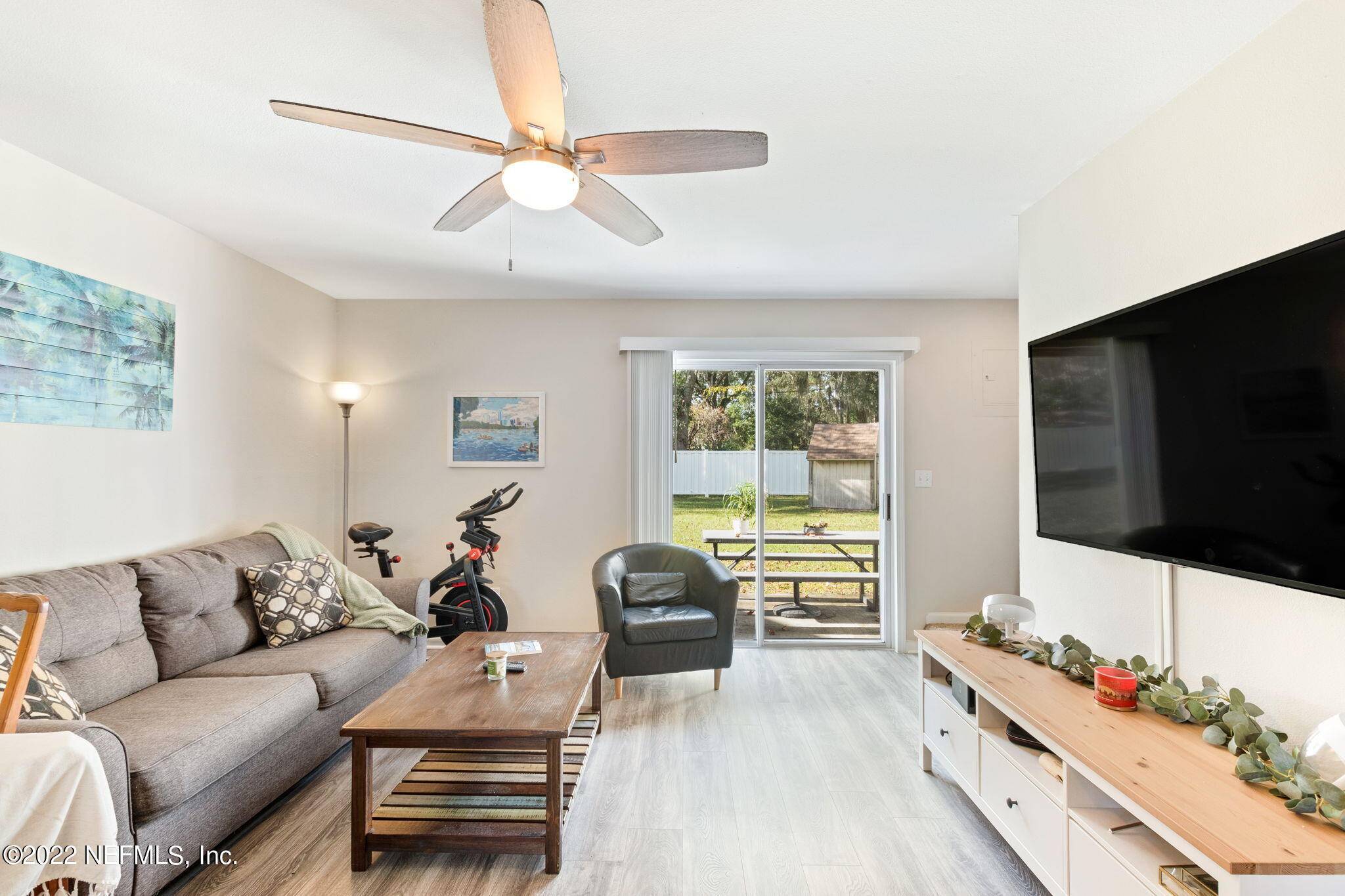 4420 Carter Road, Unit 5 St. Augustine, FL 32086 - Photo 6 of 29 a living room with furniture and a flat screen tv