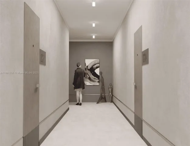 a view of staircase with railing and white walls