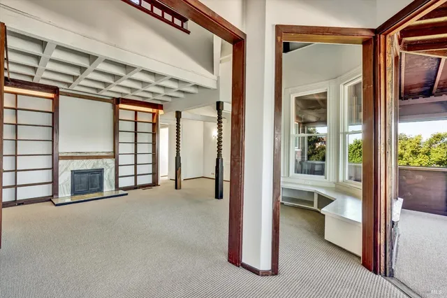 a view of an empty room with a balcony