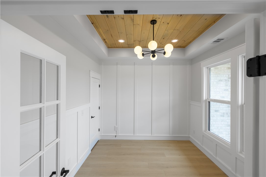 1619 Old Dobbins Bridge Road Townville, SC 29689 - Photo 14 of 34 This bright room features a striking wood tray ceiling, offering a refined and inviting space.