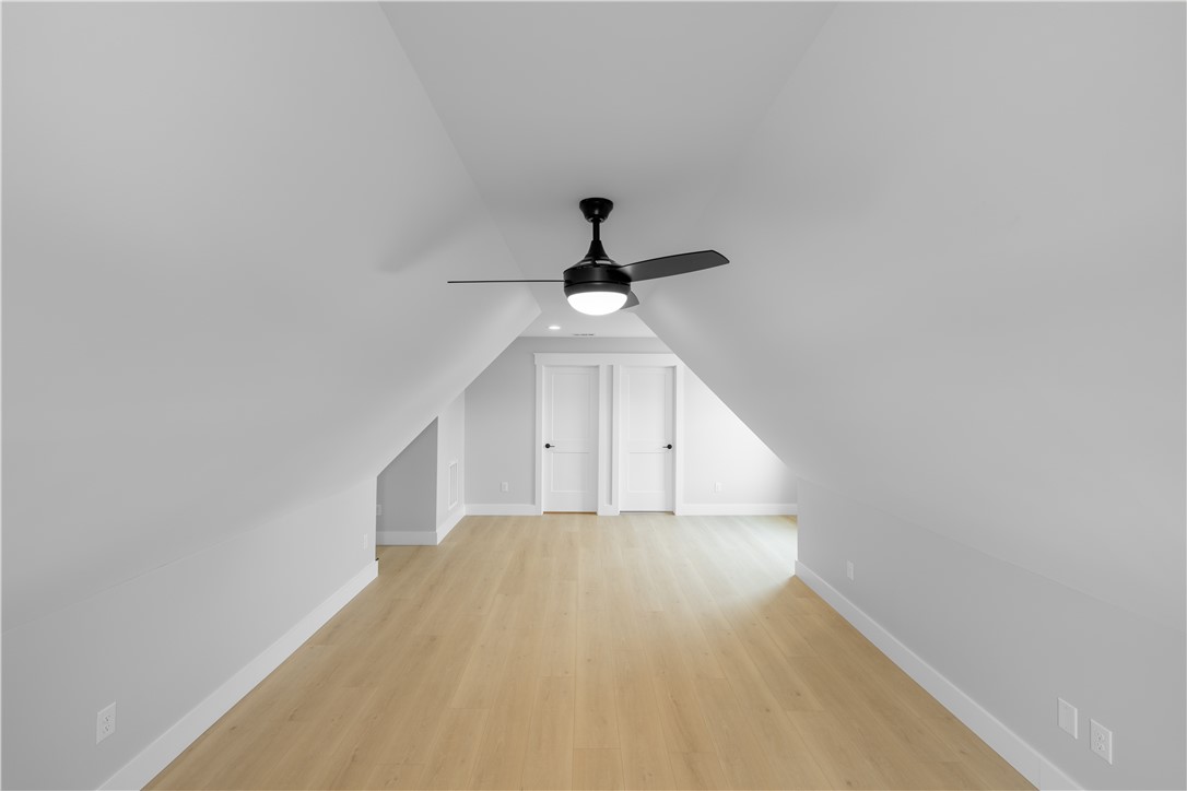 1619 Old Dobbins Bridge Road Townville, SC 29689 - Photo 15 of 34 This spacious attic room features bright walls, light wood flooring, and sloped ceilings, creating a cozy and inviting space.