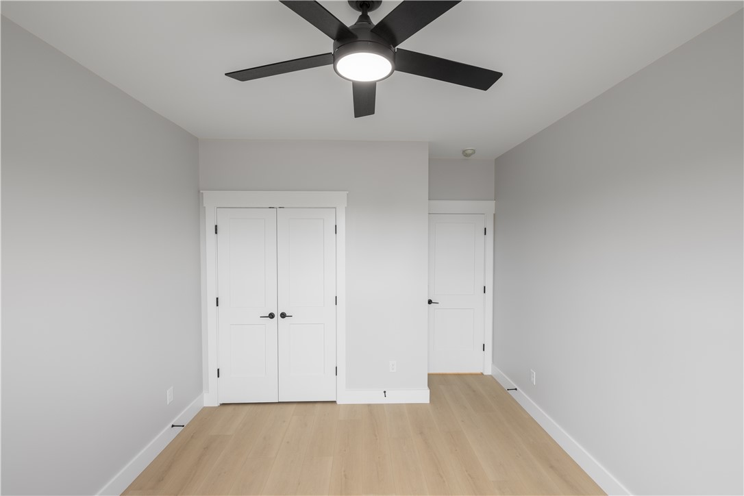 1619 Old Dobbins Bridge Road Townville, SC 29689 - Photo 16 of 34 This spacious room features light wood flooring and crisp white trim, creating a bright and inviting atmosphere.