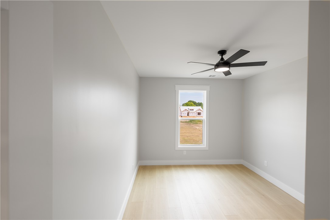 1619 Old Dobbins Bridge Road Townville, SC 29689 - Photo 17 of 34 Bright and airy, this room features expansive flooring and ample natural light.