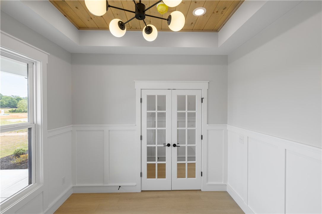 1619 Old Dobbins Bridge Road Townville, SC 29689 - Photo 19 of 34 This versatile room features elegant French doors and natural wood ceiling accents, ideal for a private office or den.