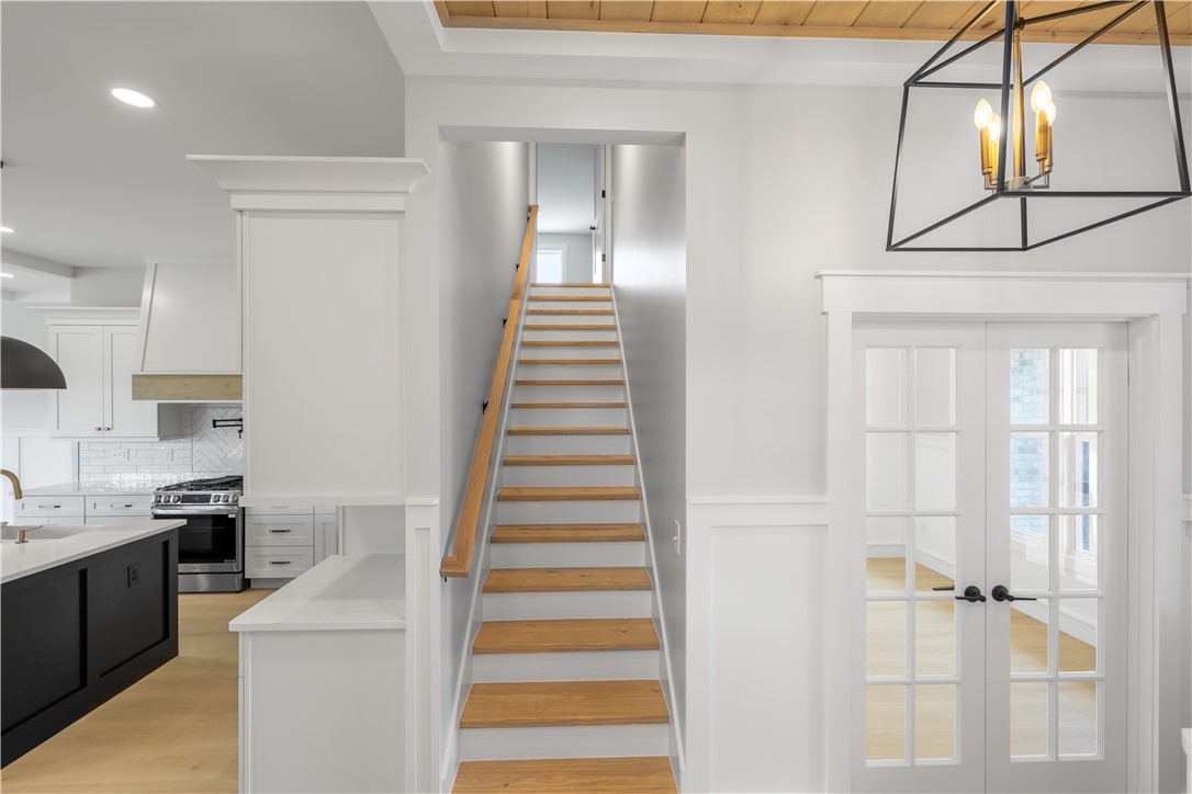 1619 Old Dobbins Bridge Road Townville, SC 29689 - Photo 20 of 34 This interior captures a stylish staircase, leading to additional rooms.