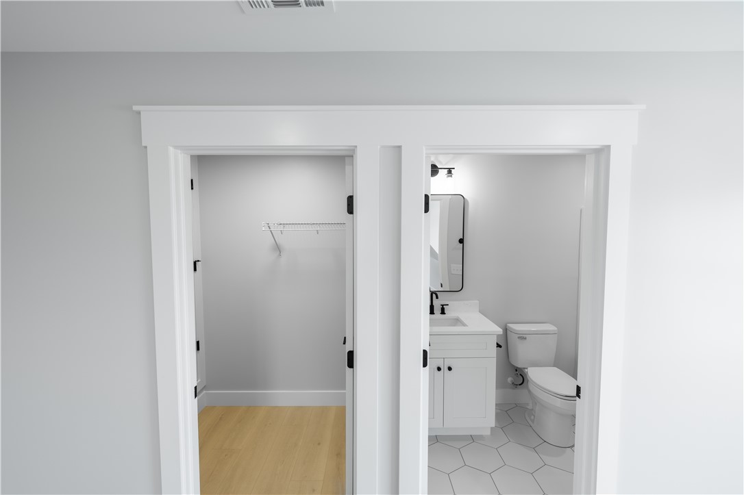 1619 Old Dobbins Bridge Road Townville, SC 29689 - Photo 26 of 34 This modern space offers both a functional walk-in closet and a well-appointed bathroom.