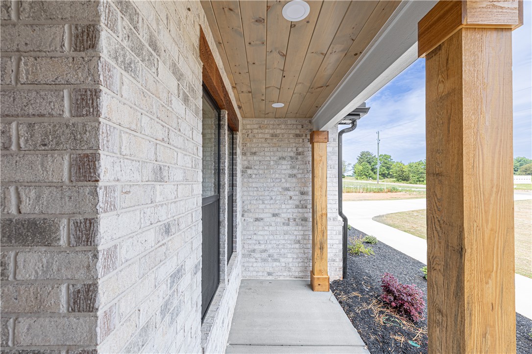 1619 Old Dobbins Bridge Road Townville, SC 29689 - Photo 5 of 34 This inviting porch features sturdy wooden columns and a stylish wood-paneled ceiling.