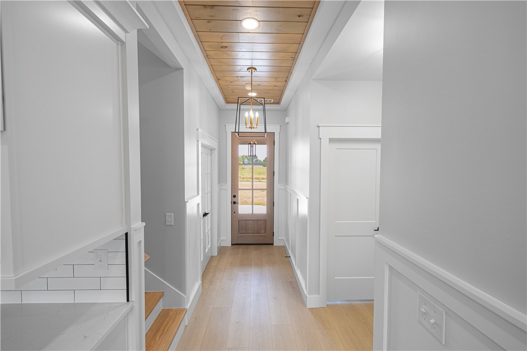 1619 Old Dobbins Bridge Road Townville, SC 29689 - Photo 7 of 34 Step into this welcoming entrance foyer featuring light wood flooring and ceiling accents.