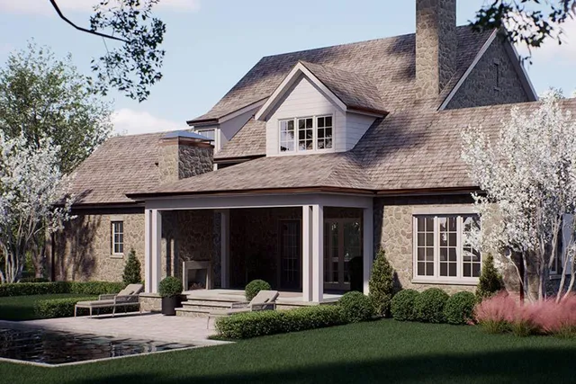 a front view of a house with a yard and trees