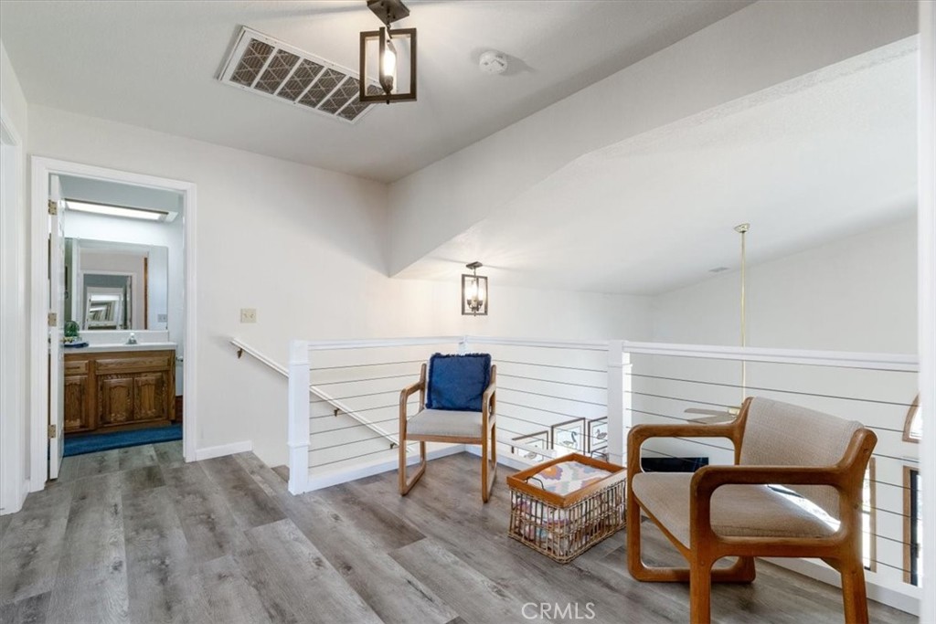 12355 Santa Ana Road Atascadero, CA 93422 - Photo 16 of 57 a bedroom with furniture and wooden floor