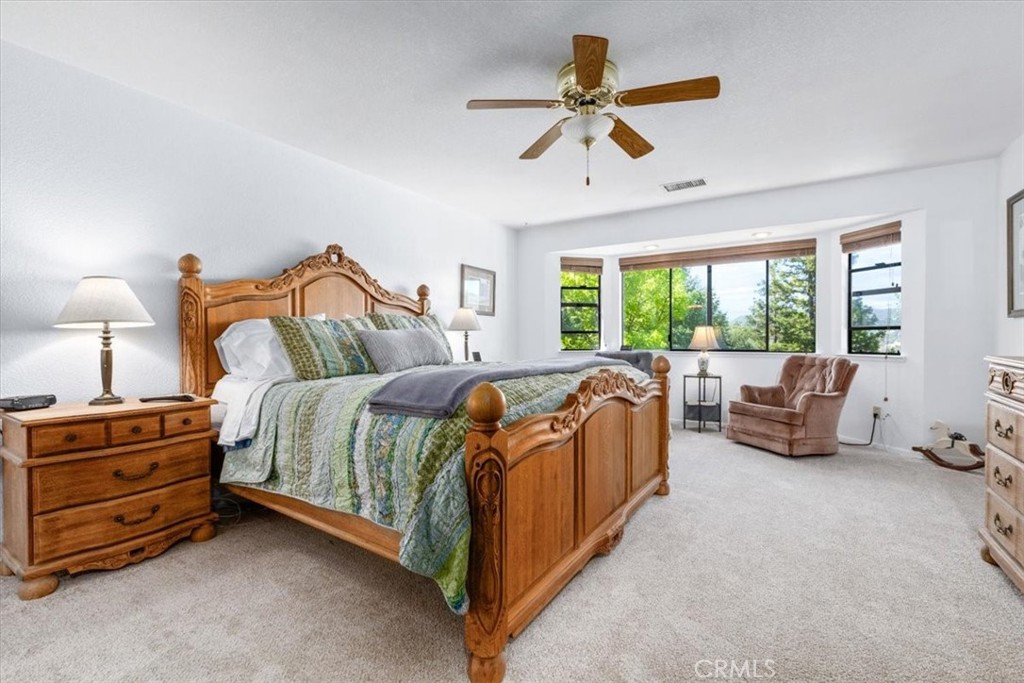 12355 Santa Ana Road Atascadero, CA 93422 - Photo 18 of 57 a bedroom with a bed and a couch