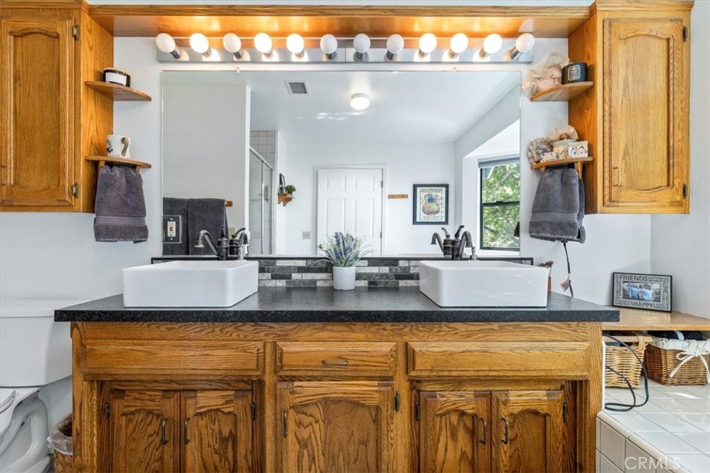 12355 Santa Ana Road Atascadero, CA 93422 - Photo 19 of 57 a kitchen with a sink and a refrigerator