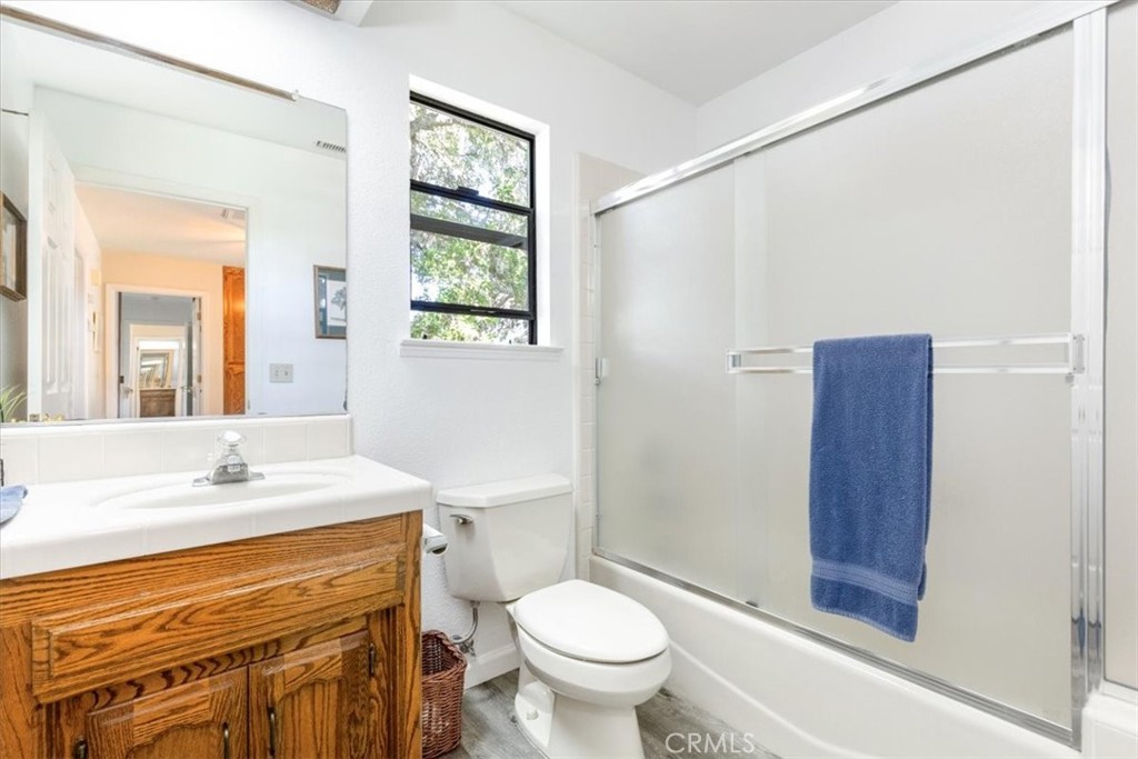 12355 Santa Ana Road Atascadero, CA 93422 - Photo 25 of 57 a bathroom with a sink toilet and shower