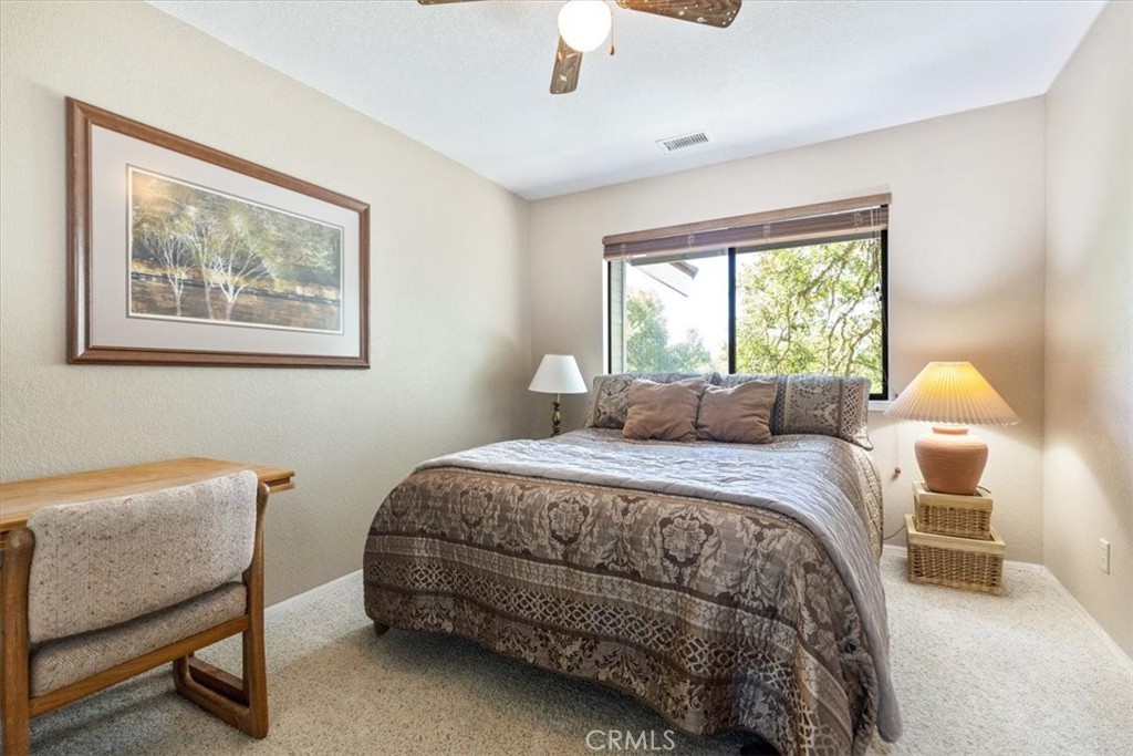 12355 Santa Ana Road Atascadero, CA 93422 - Photo 26 of 57 a bedroom with a bed and window