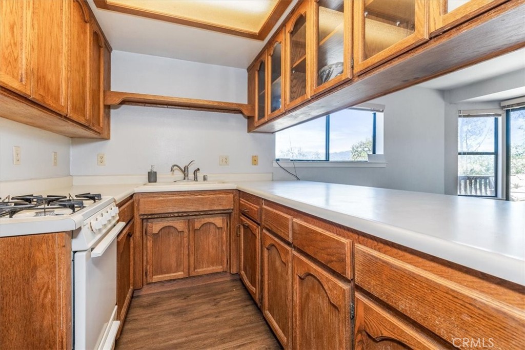 12355 Santa Ana Road Atascadero, CA 93422 - Photo 40 of 57 a kitchen with stainless steel appliances granite countertop a sink and a stove