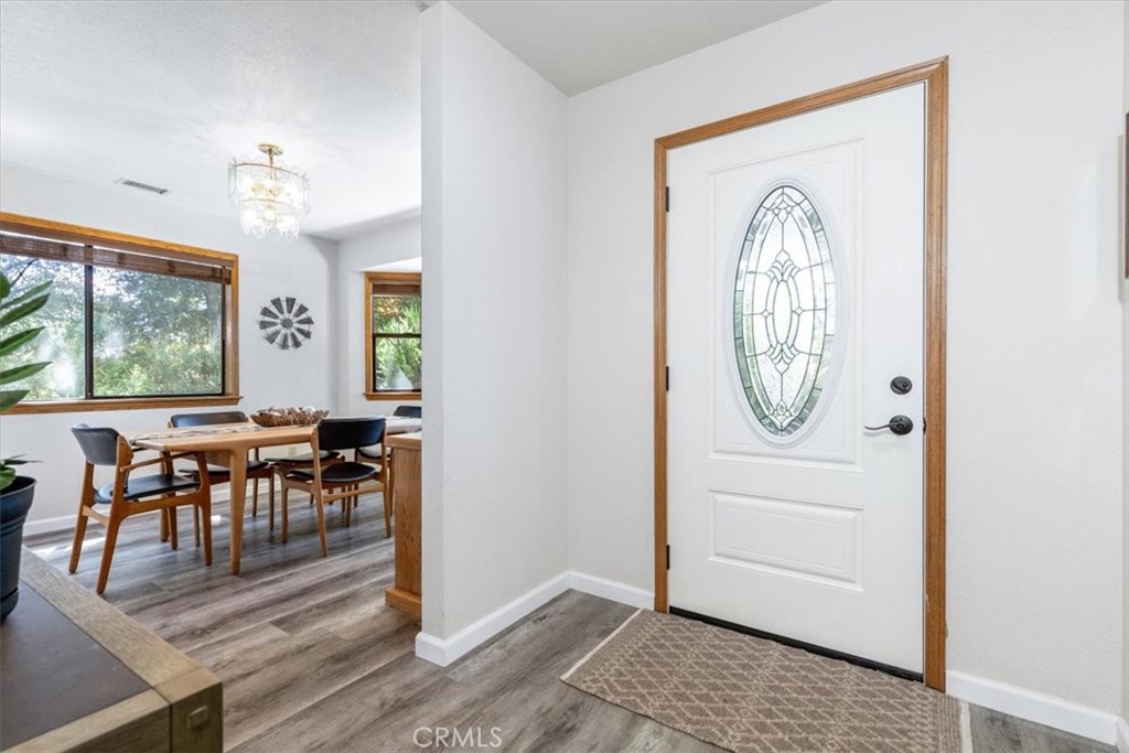 12355 Santa Ana Road Atascadero, CA 93422 - Photo 4 of 57 an entryway dining room and hall with wooden floor