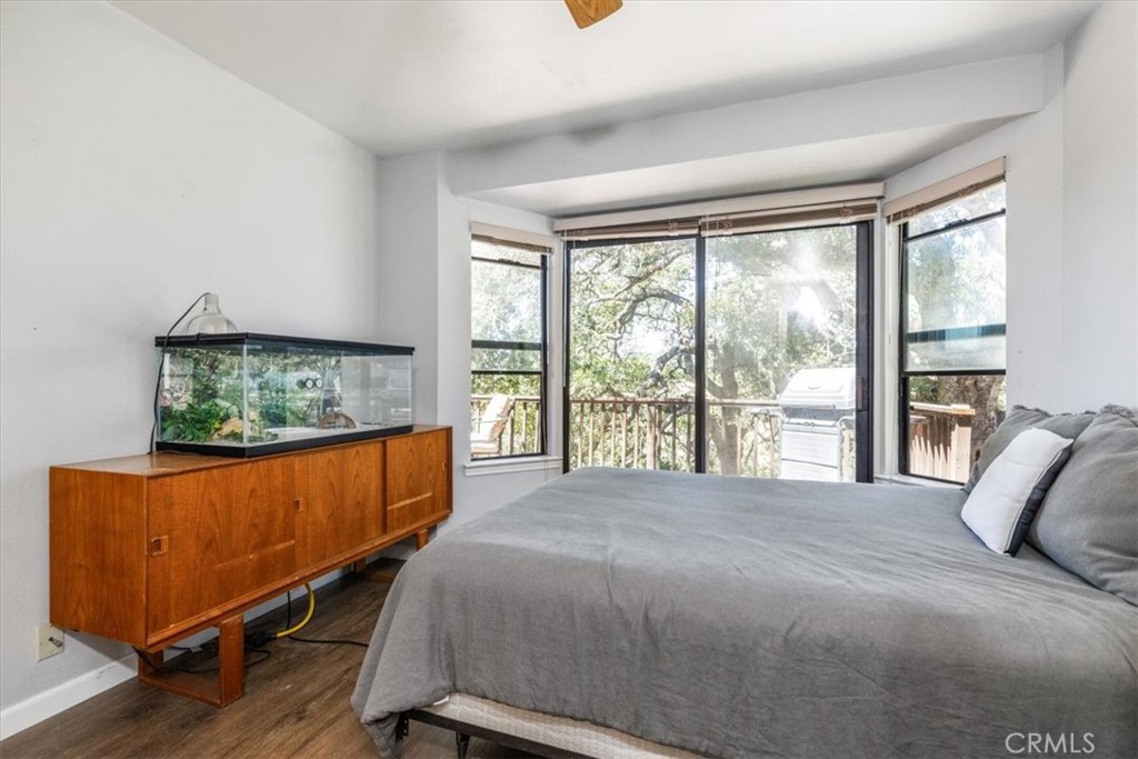 12355 Santa Ana Road Atascadero, CA 93422 - Photo 42 of 57 a bed sitting in a bedroom next to a window